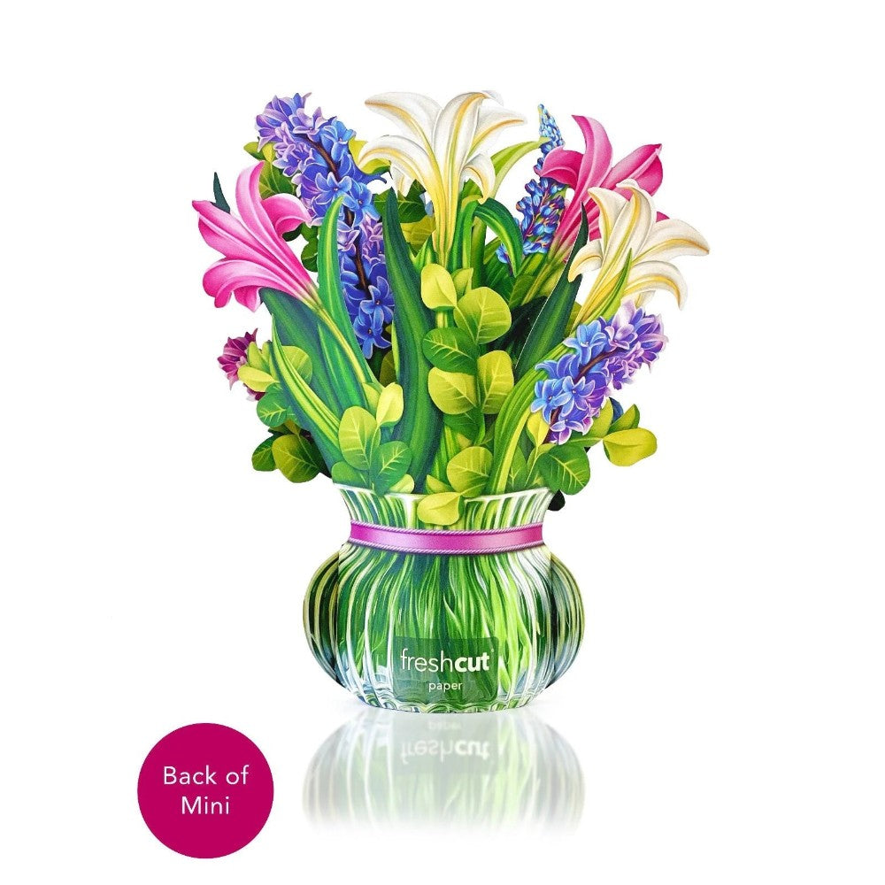 Paper bouquet of colorful flowers in a vase.