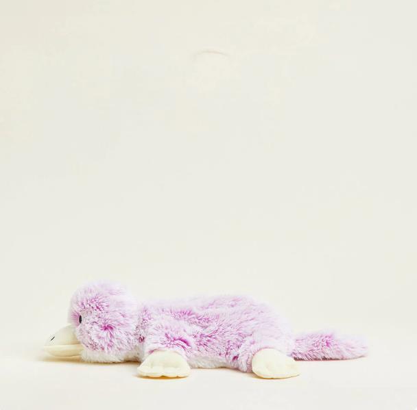 Plush pink platypus toy on white background.