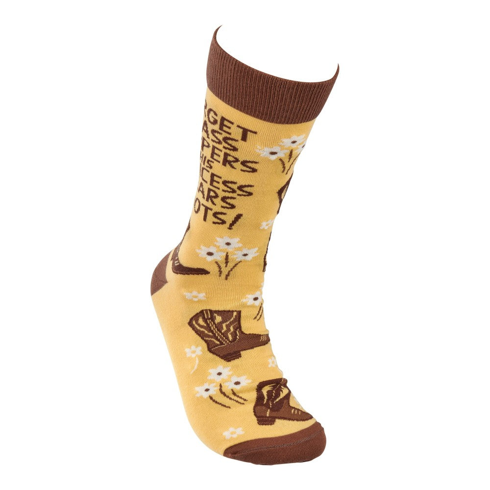 Yellow sock with cowboy boots, flowers, and brown text design.