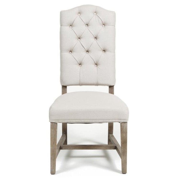 Elegant tufted chair with wooden legs.