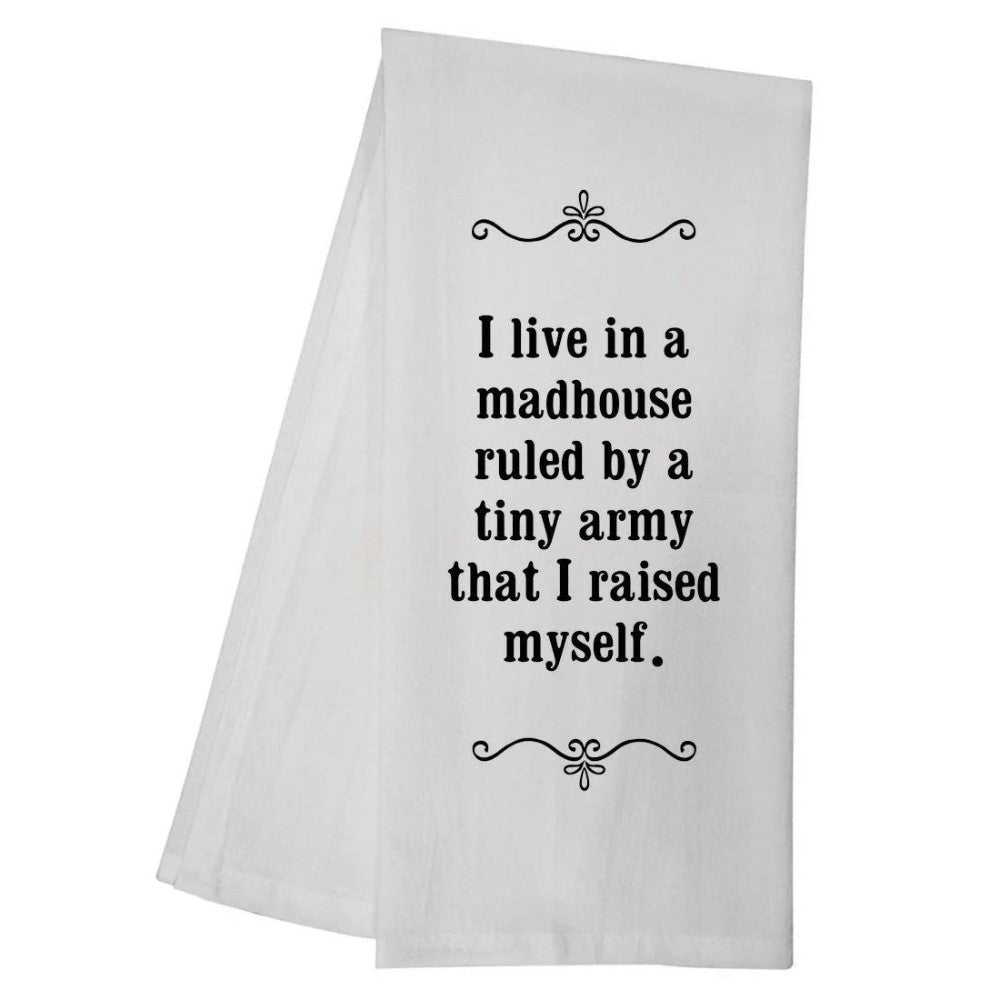 White towel with humorous text about parenting chaos.