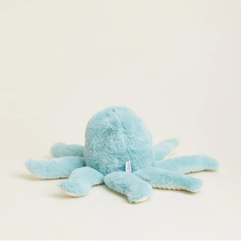 Light blue plush octopus toy on a neutral background.