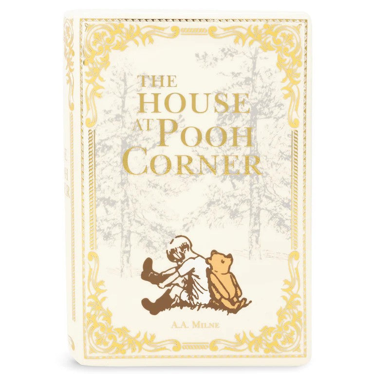 Vintage book cover of "The House at Pooh Corner" with gold accents.
