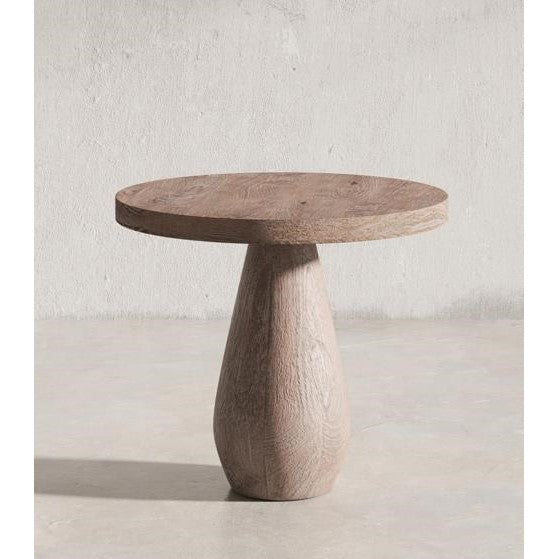 Round wooden table with a smooth, tapered base.