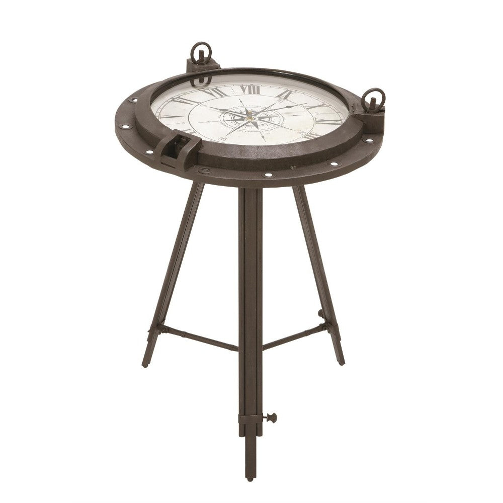 Metal tripod table with compass-style clock top.
