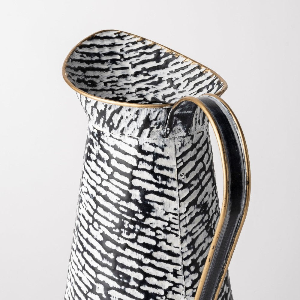 Black and white textured pitcher with gold accents.