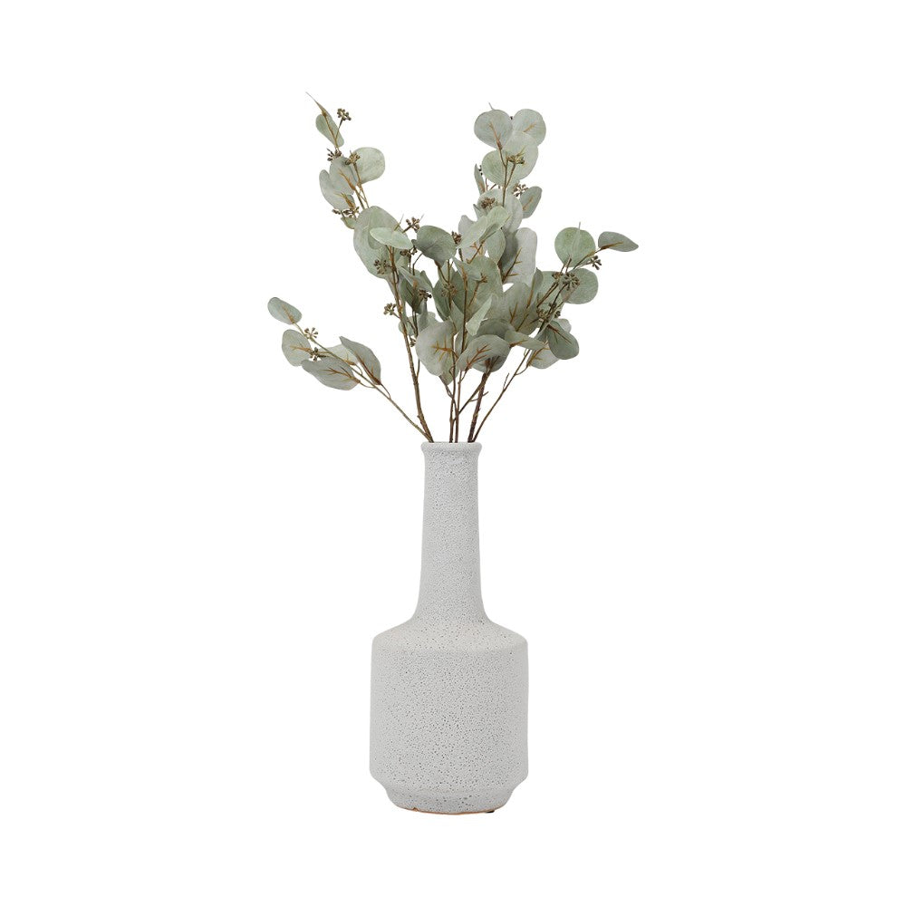 Gray vase with eucalyptus branches.