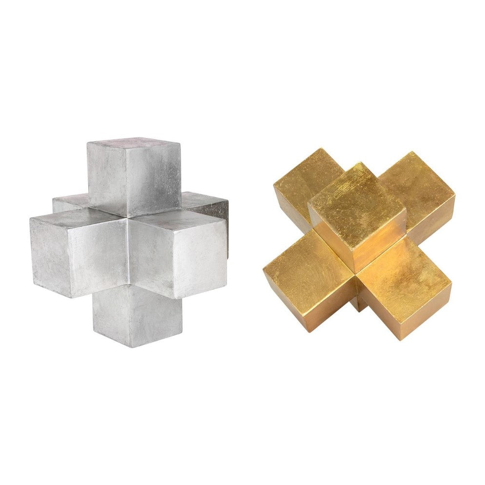 Two metallic cross-shaped sculptures: one silver, one gold.