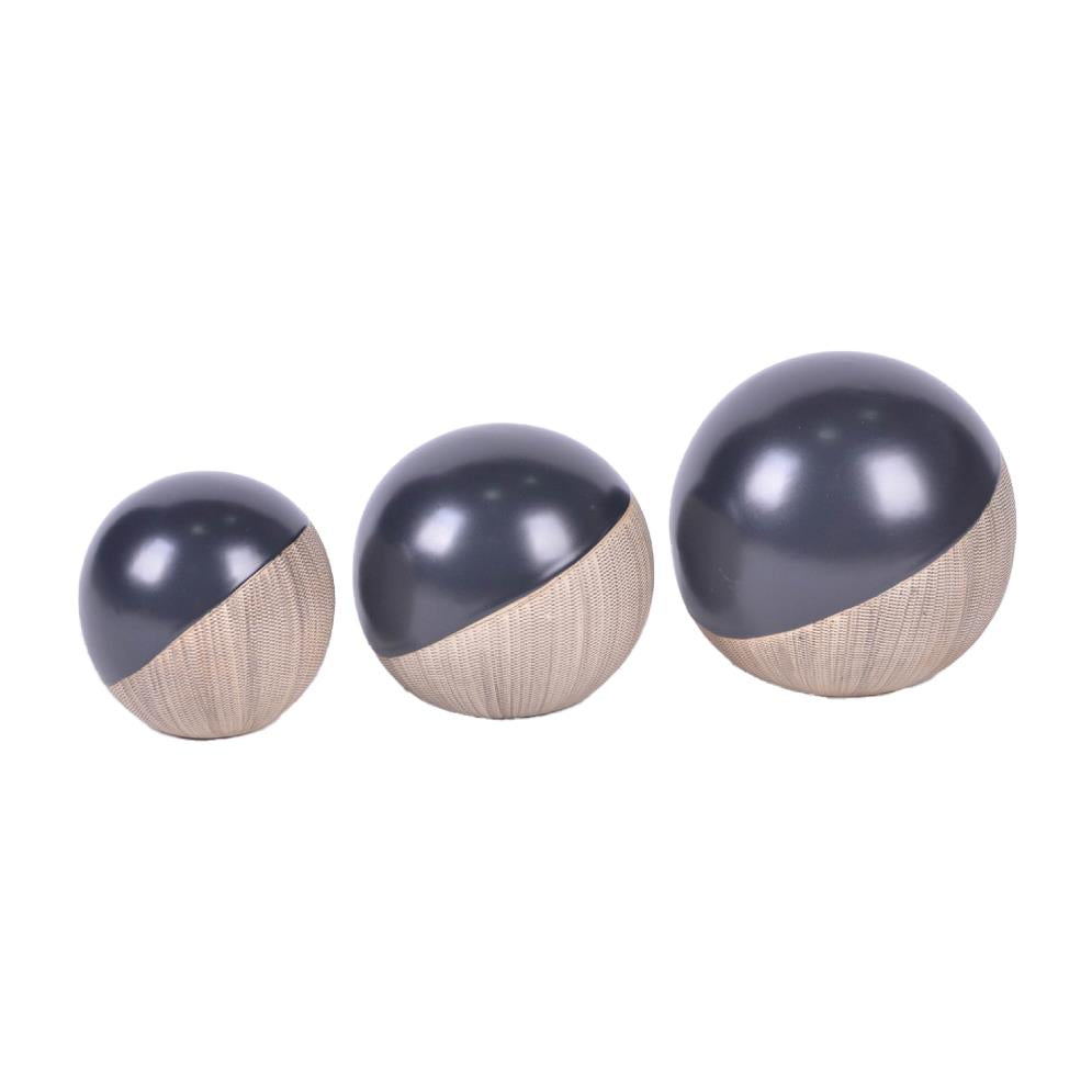 Three modern decorative spheres, black and beige, in varying sizes.
