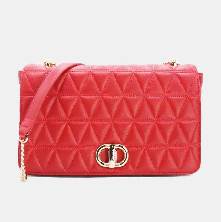 Red quilted handbag with gold clasp and chain strap.