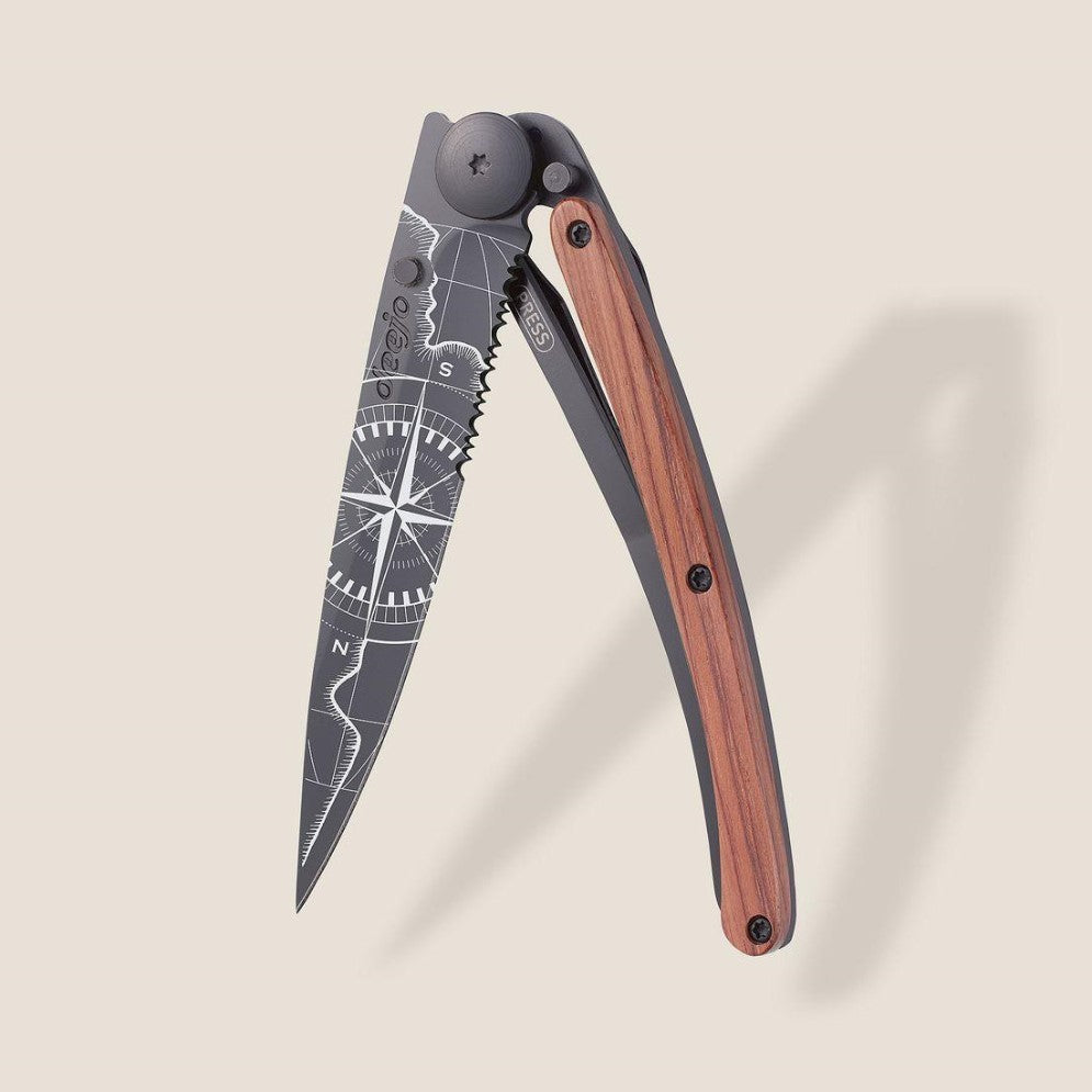 Folding knife with a compass design and wooden handle.