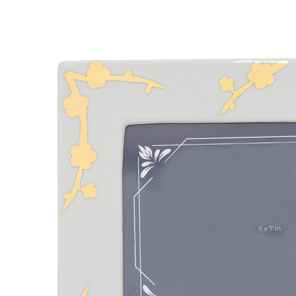 Photo frame with gold floral design, size 5x7 inches.