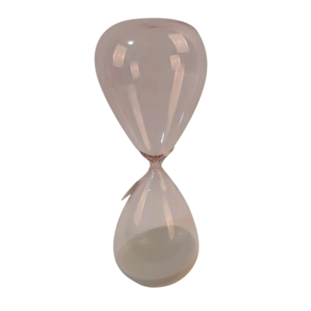 Transparent hourglass with sand inside.