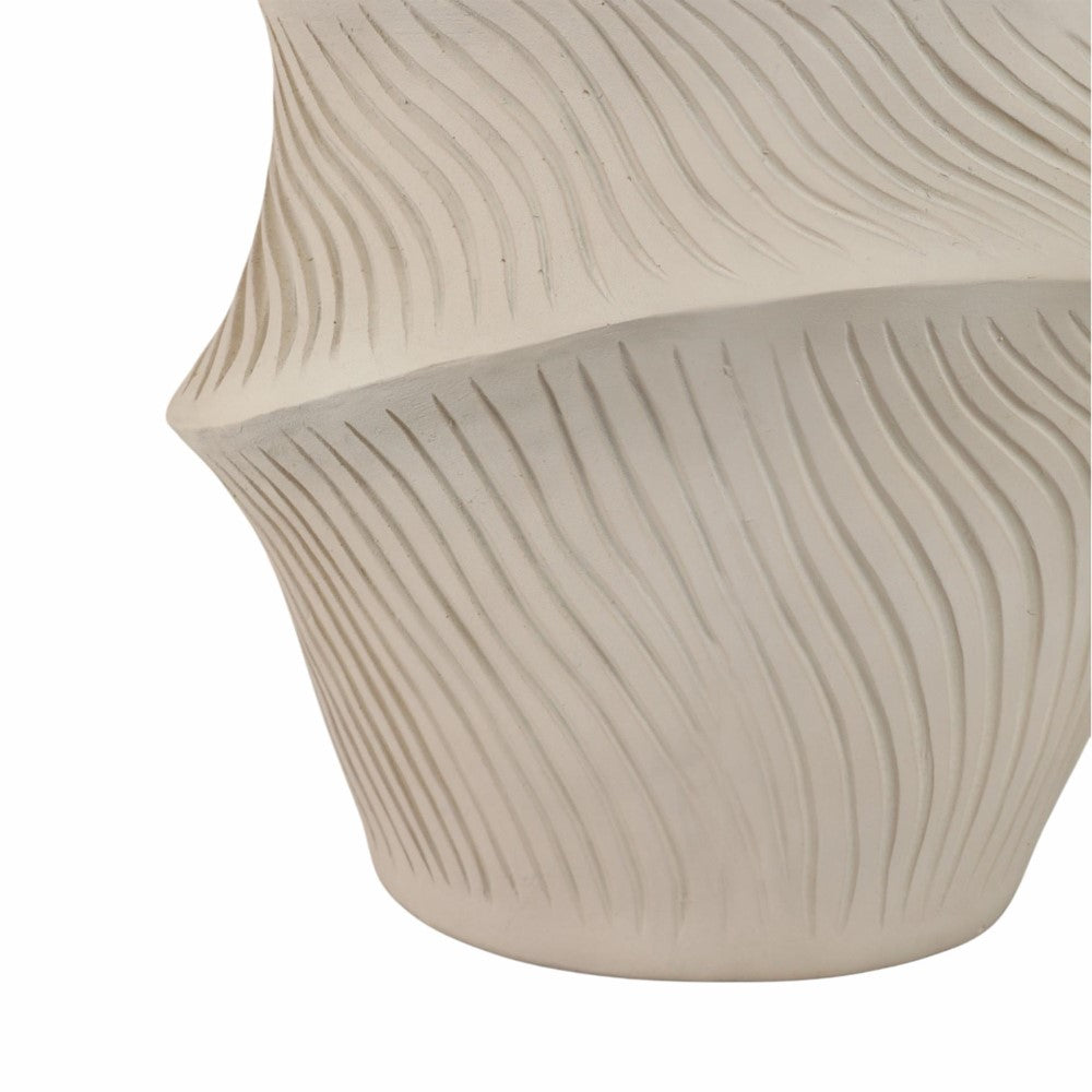 Curved ceramic vase with wave-like grooves.