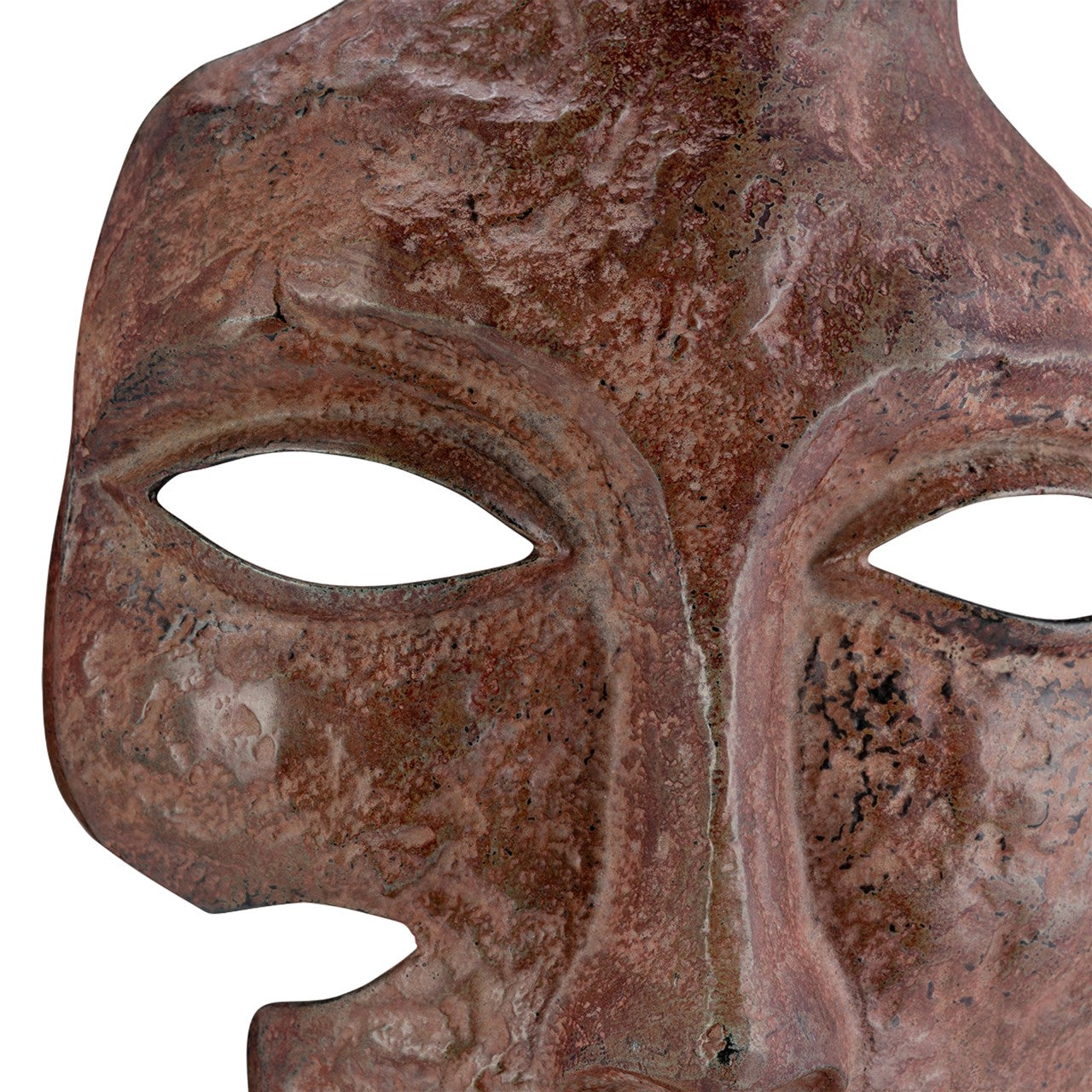Antique rusted metal mask with eye cutouts.