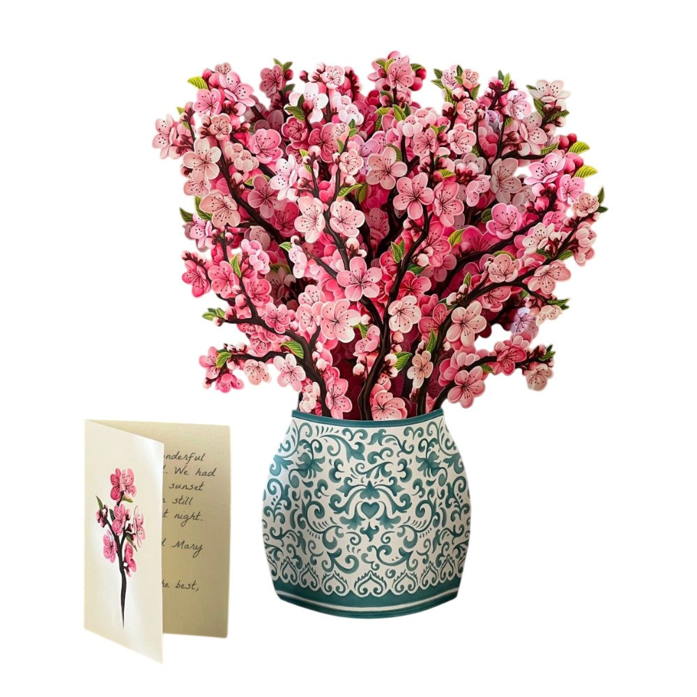 Pink blossoms in ornate vase with matching card.