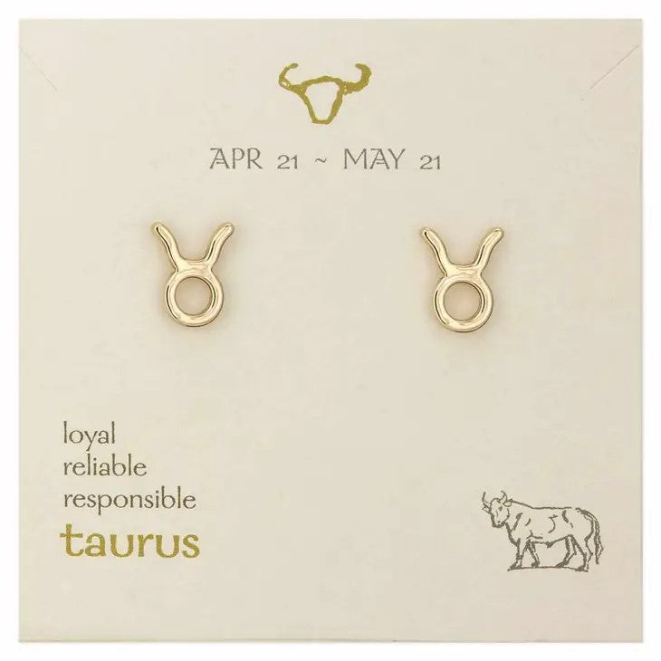 Gold Taurus earrings on a zodiac card with bull symbol.