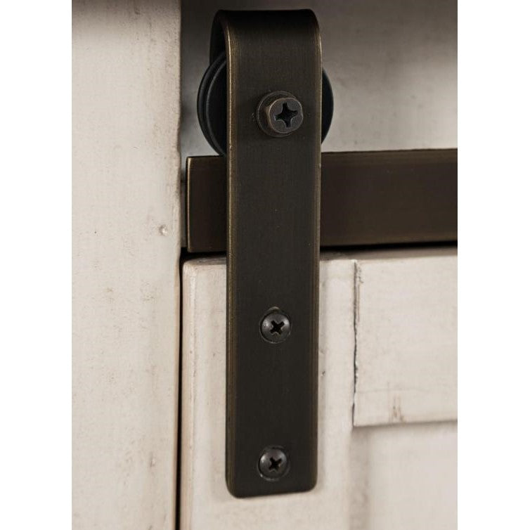 Sliding barn door hardware on a wooden door.
