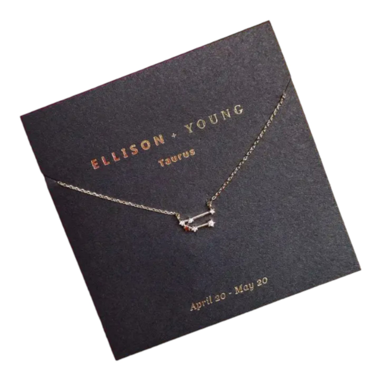 Taurus constellation necklace on dark card with gold lettering.