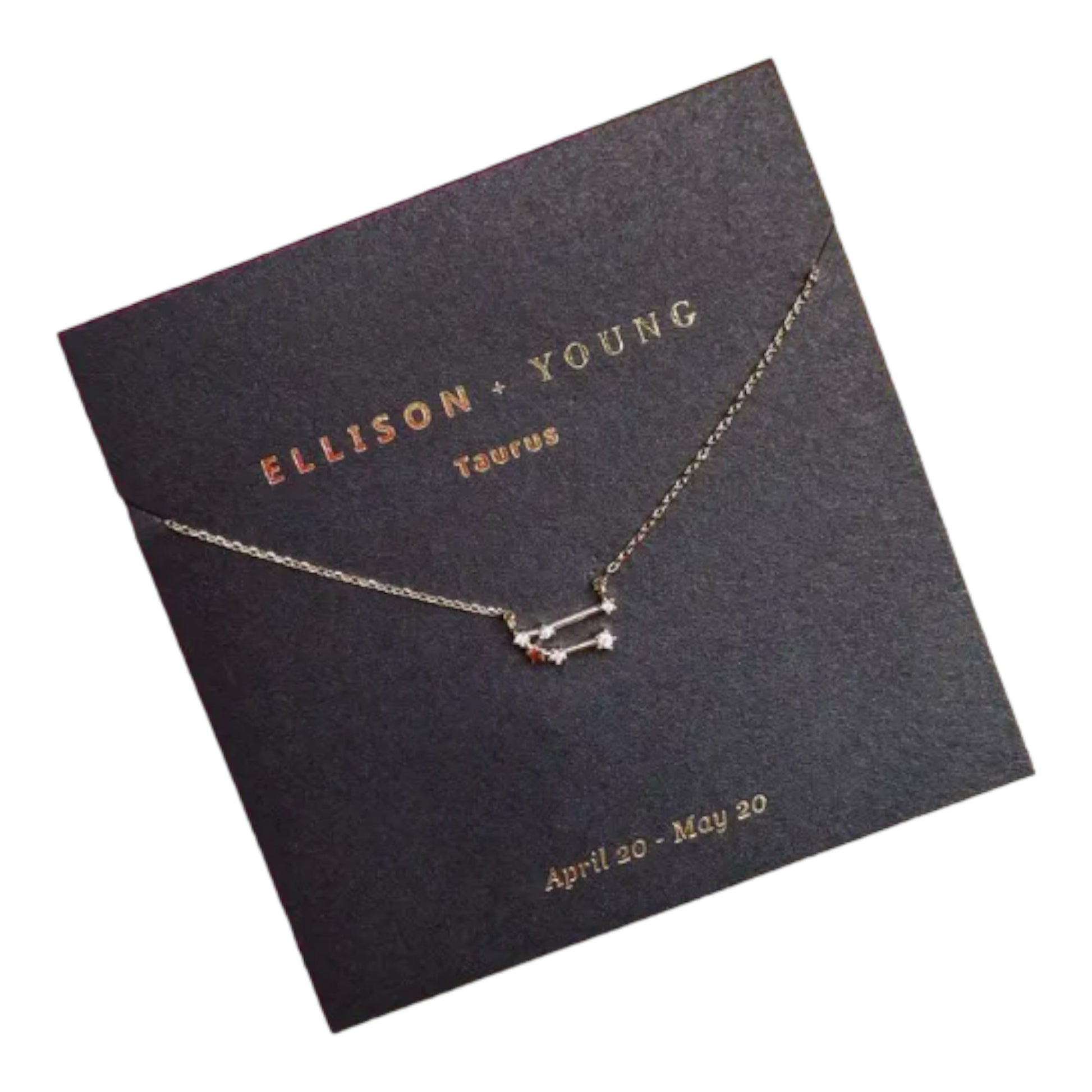 Taurus constellation necklace on dark card with gold lettering.