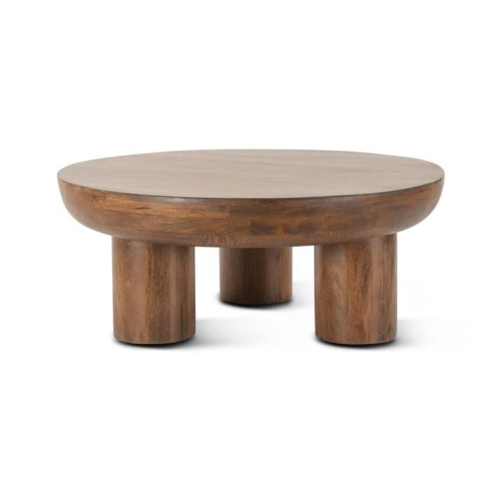 Round wooden coffee table with four cylindrical legs.