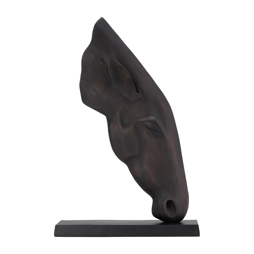 Dark, abstract horse head sculpture on a rectangular base.