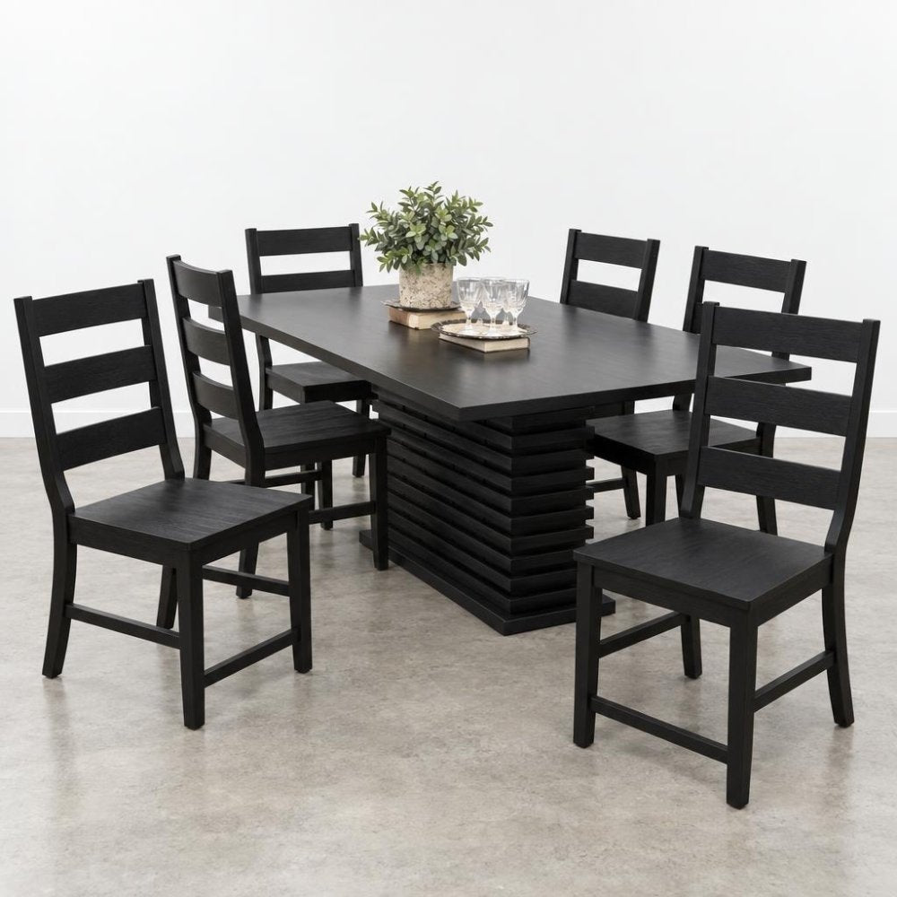 Black dining set with six chairs and a decorative plant centerpiece.