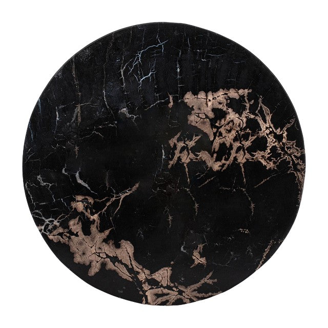 Round black object with golden veins on its surface.