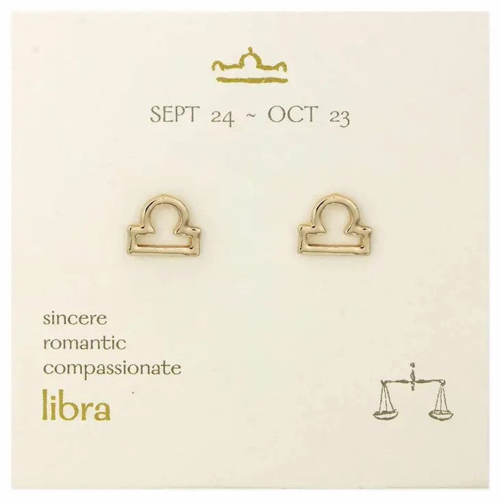 Libra earrings on display card with traits: sincere, romantic, compassionate.