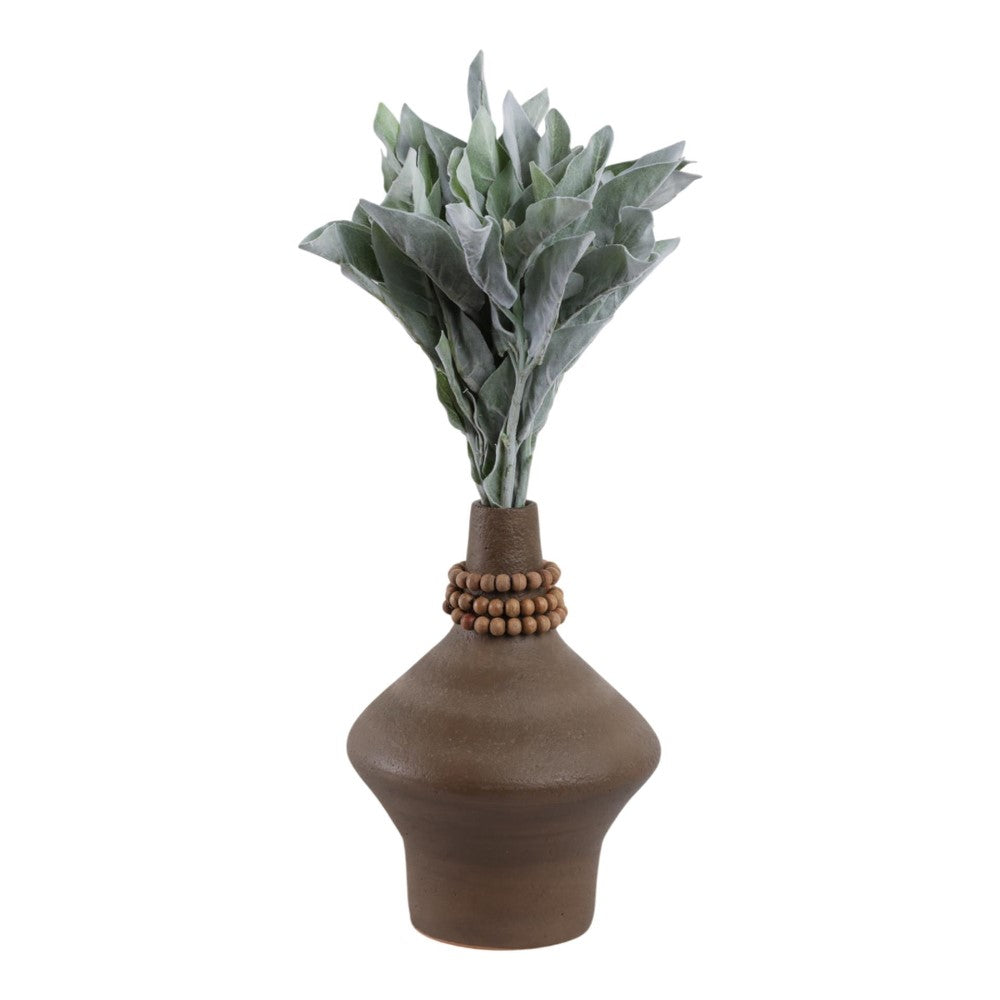 Brown vase with green leaves and wooden beads.