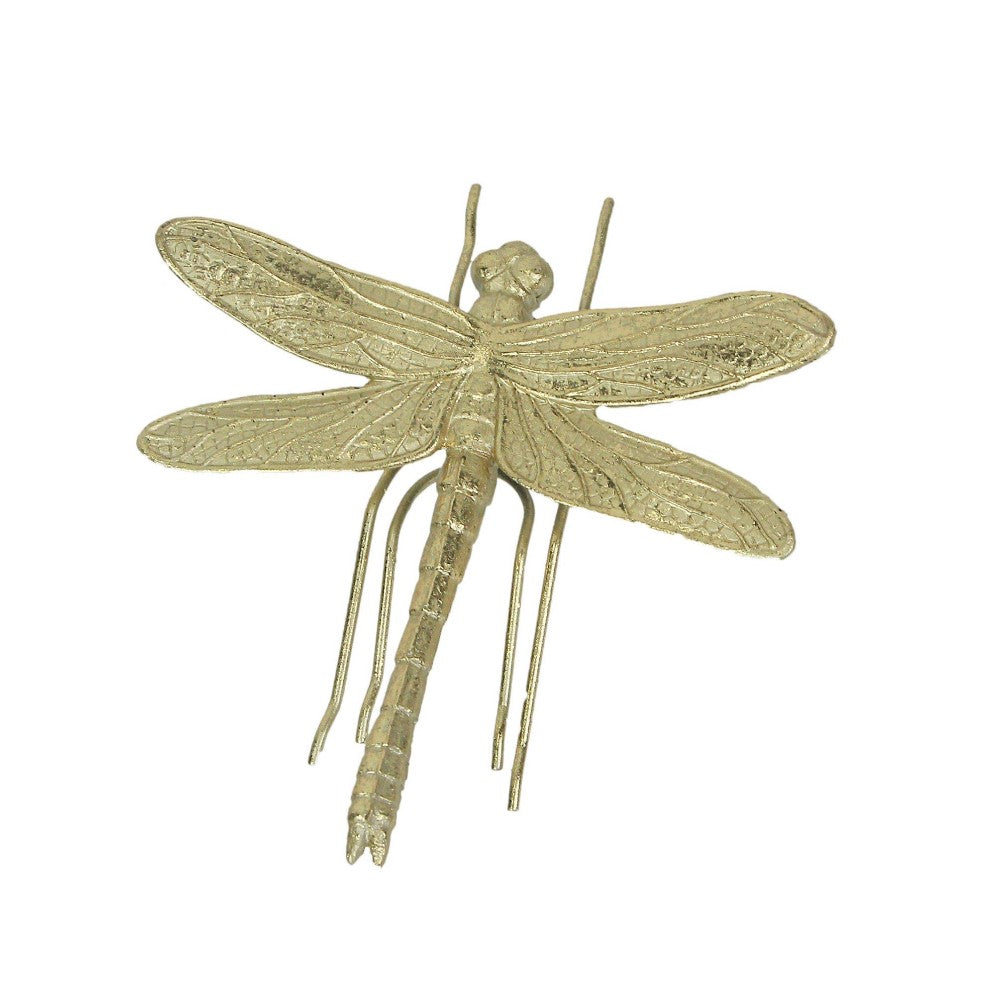 Golden dragonfly sculpture with detailed wings.