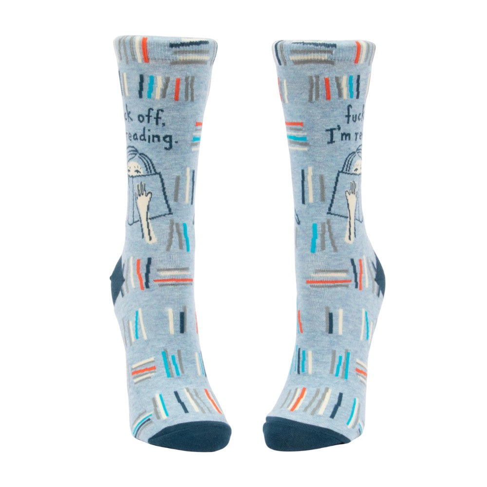 Blue socks with books and text: "I'm reading."