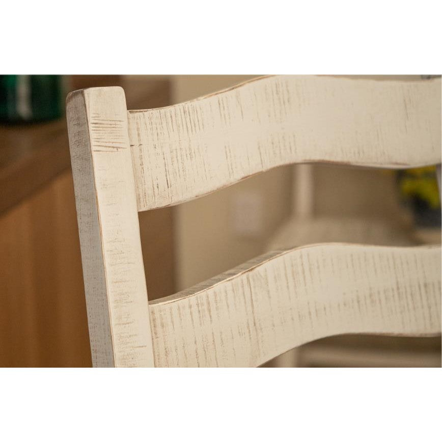 Close-up of a distressed wood chair back with horizontal slats.