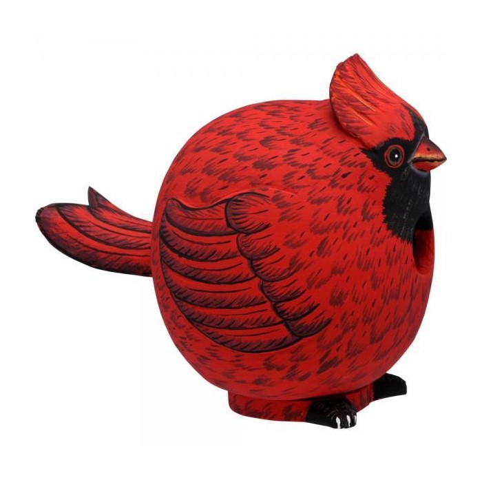Round red bird sculpture with black markings and a prominent tail.