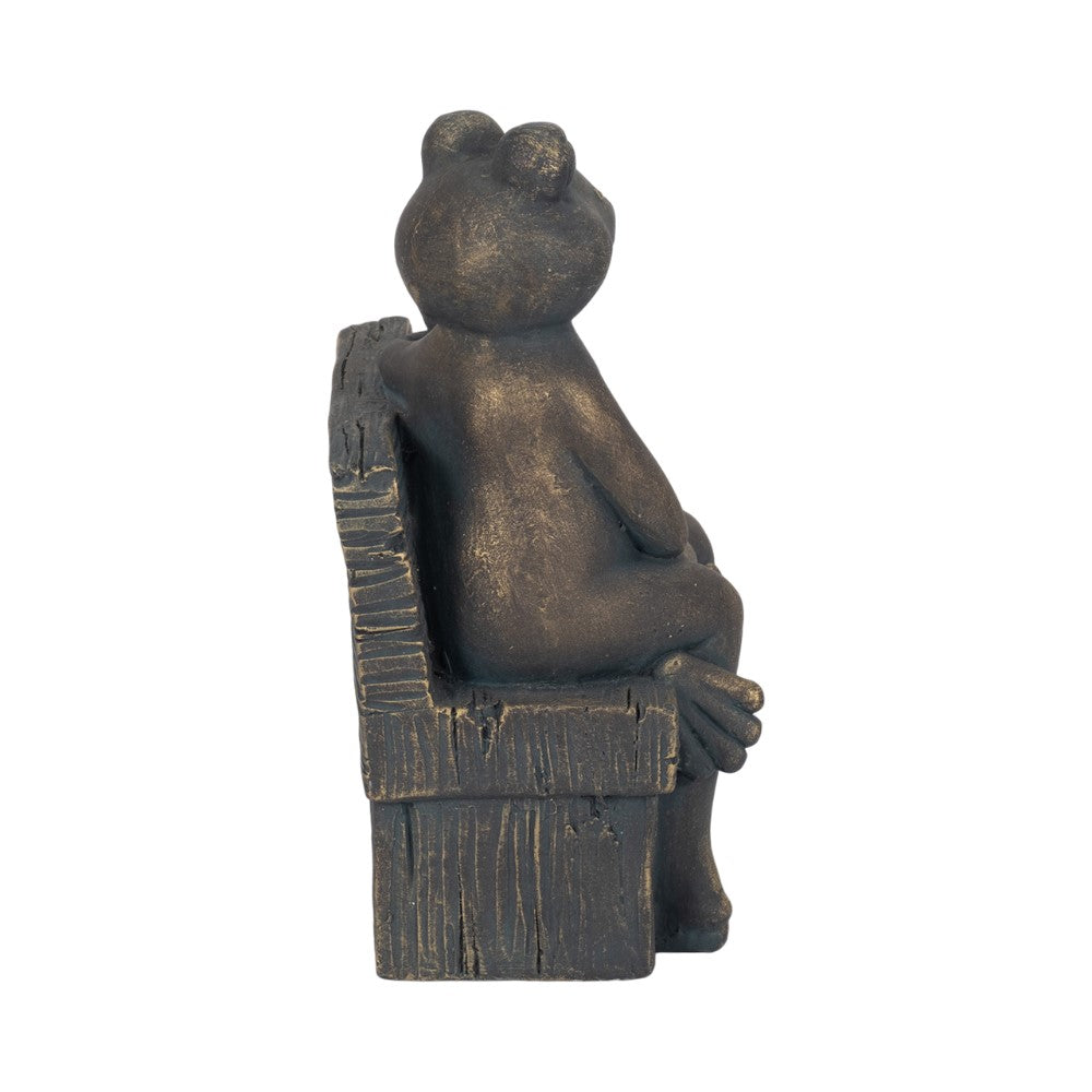 Bronze frog sculpture sitting on a bench.