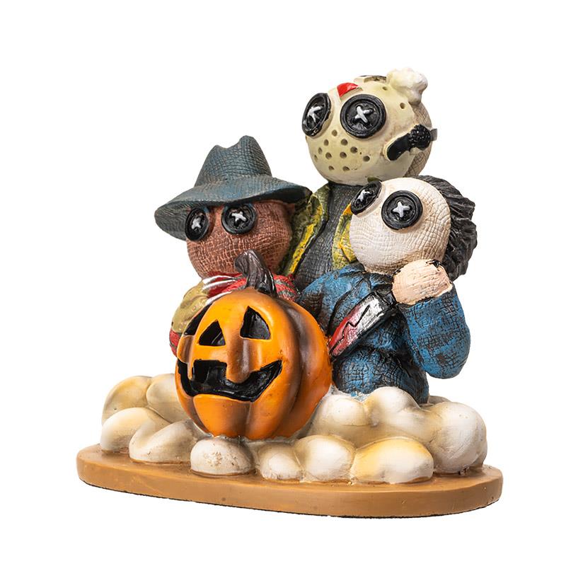 Cute horror-themed figurines with a jack-o'-lantern.