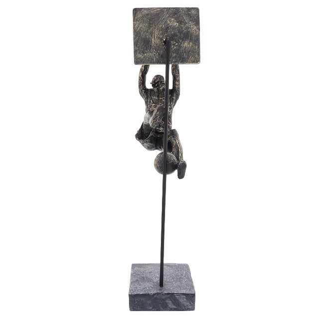 Bronze sculpture of a basketball player dunking.