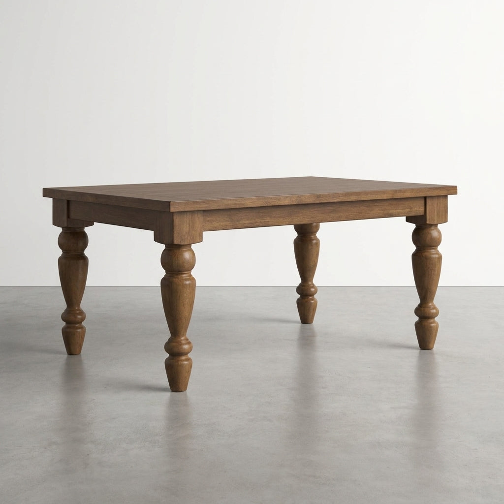 Wooden table with turned legs on a gray floor.