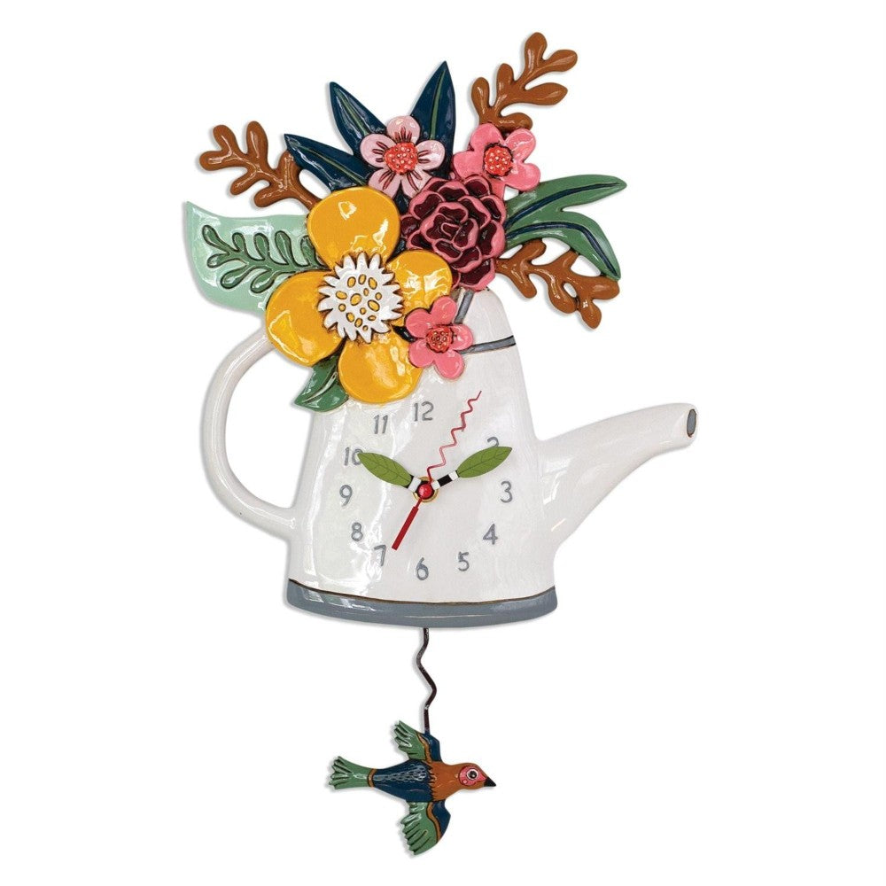 Watering can clock with flowers and a hanging bird.
