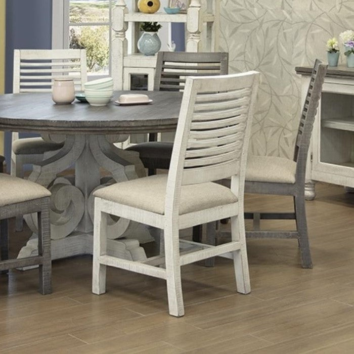 Wooden dining set with beige chairs and a round table in a cozy room.