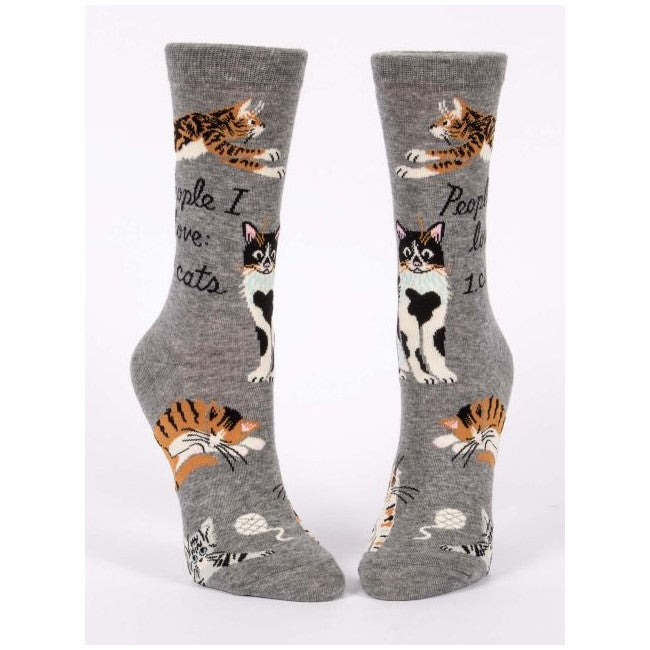 Gray socks with playful cat illustrations and text.