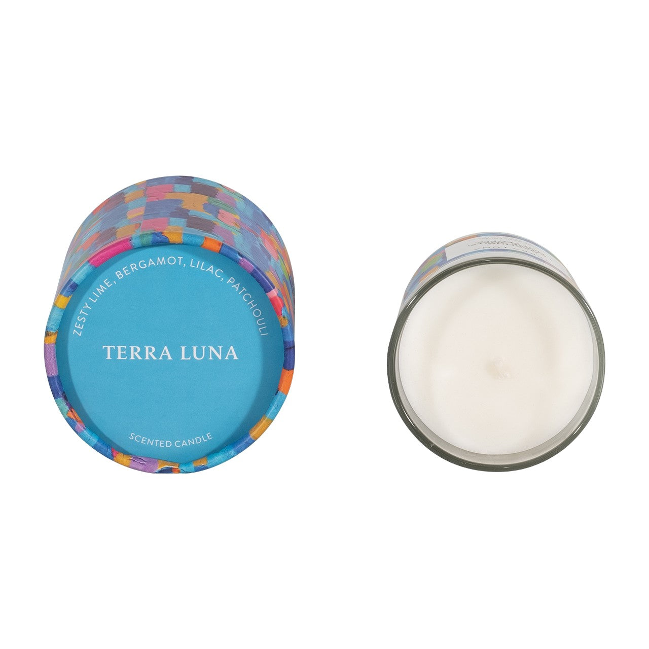Colorful "Terra Luna" scented candle and lid, featuring lime, bergamot, lilac, and patchouli.