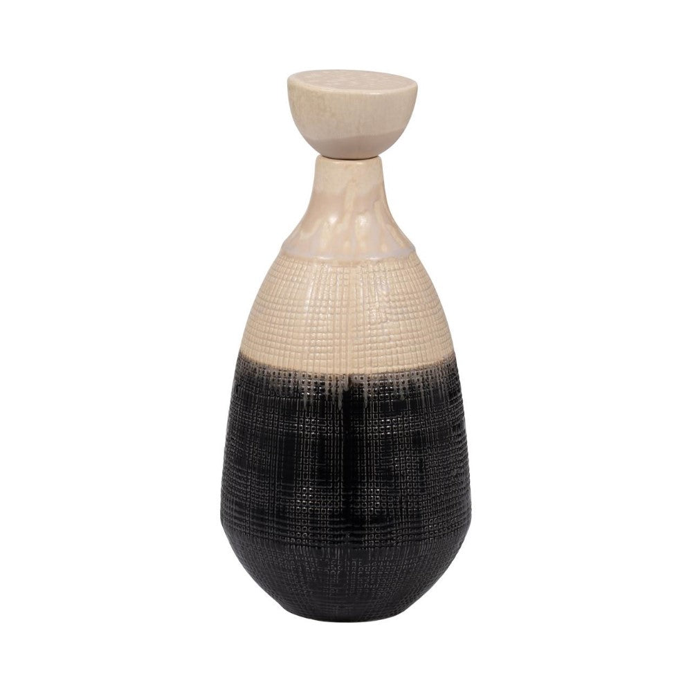 Two-toned textured vase with a rounded shape and a flat top.
