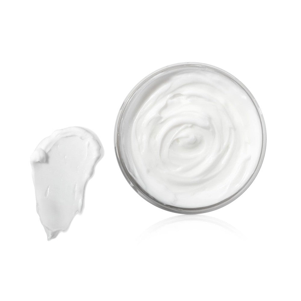 A jar of white cream with a dollop beside it on a white background.