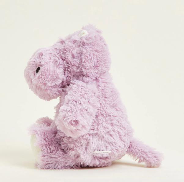 Fluffy lavender stuffed hippo sitting.