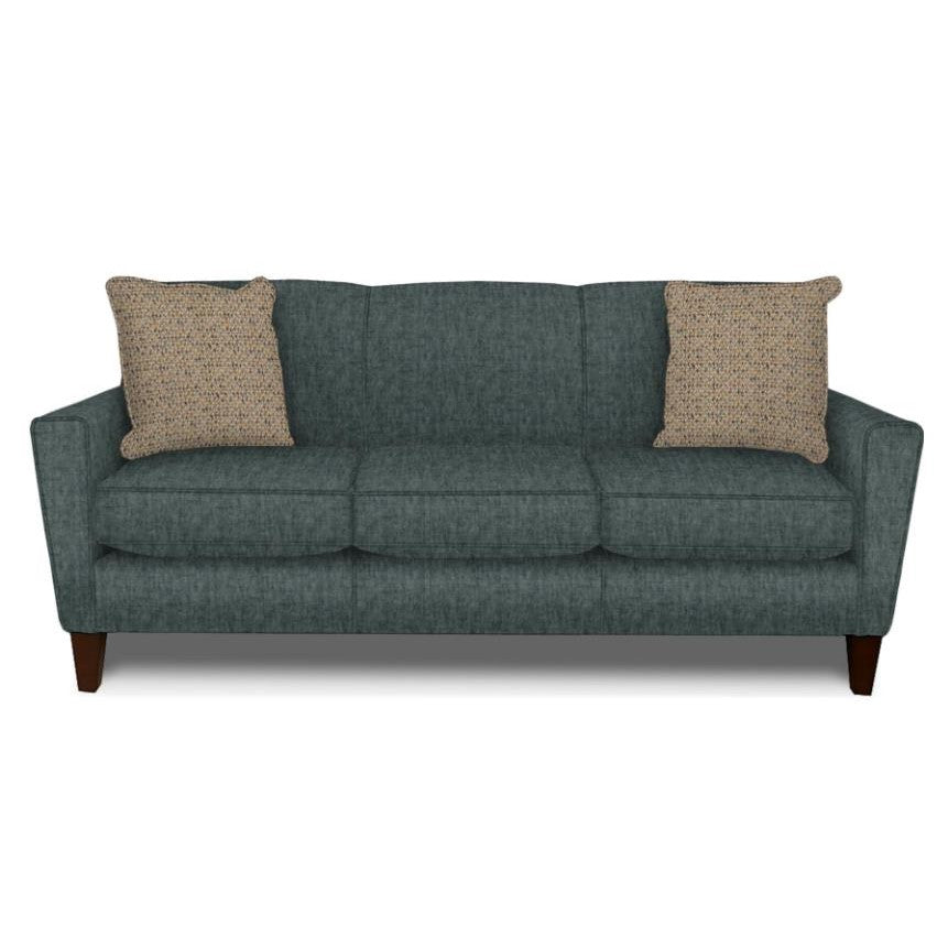Gray sofa with two beige pillows on a white background.