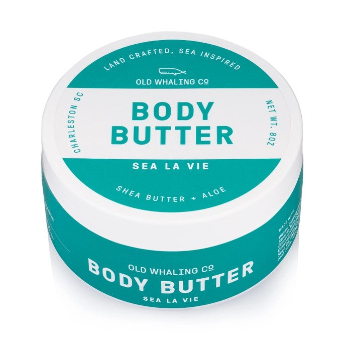 Body butter container labeled "Sea La Vie" with shea butter and aloe.
