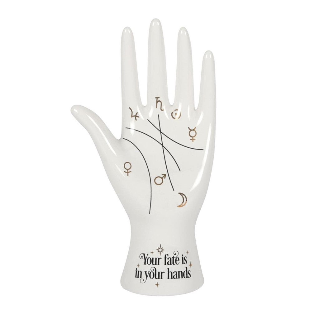 Ceramic hand with symbols and "Your fate is in your hands" inscription.