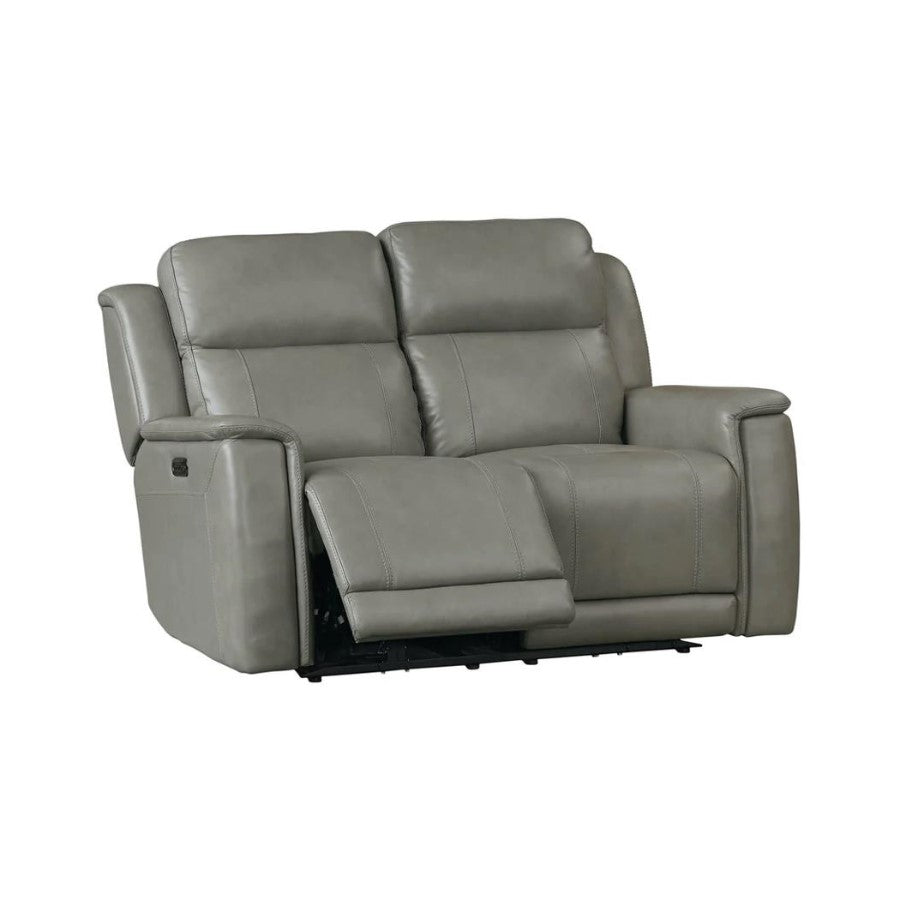 Gray leather recliner loveseat with extended footrest.