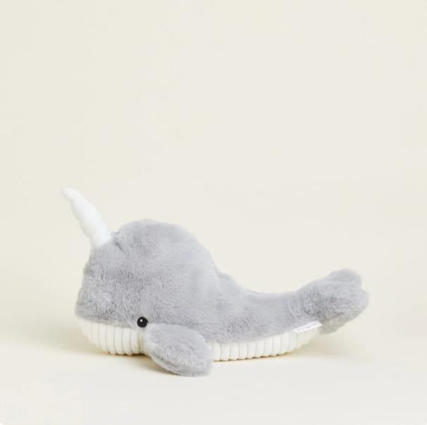 Gray plush narwhal toy with a white horn and belly.